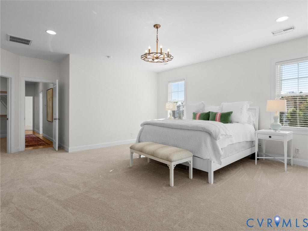 1412 Ascot Hill Terrace, Midlothian, VA 23112 Spacious room featuring neutral carpeting, recessed lighting, a multi-arm chandelier, and large windows with integrated blinds