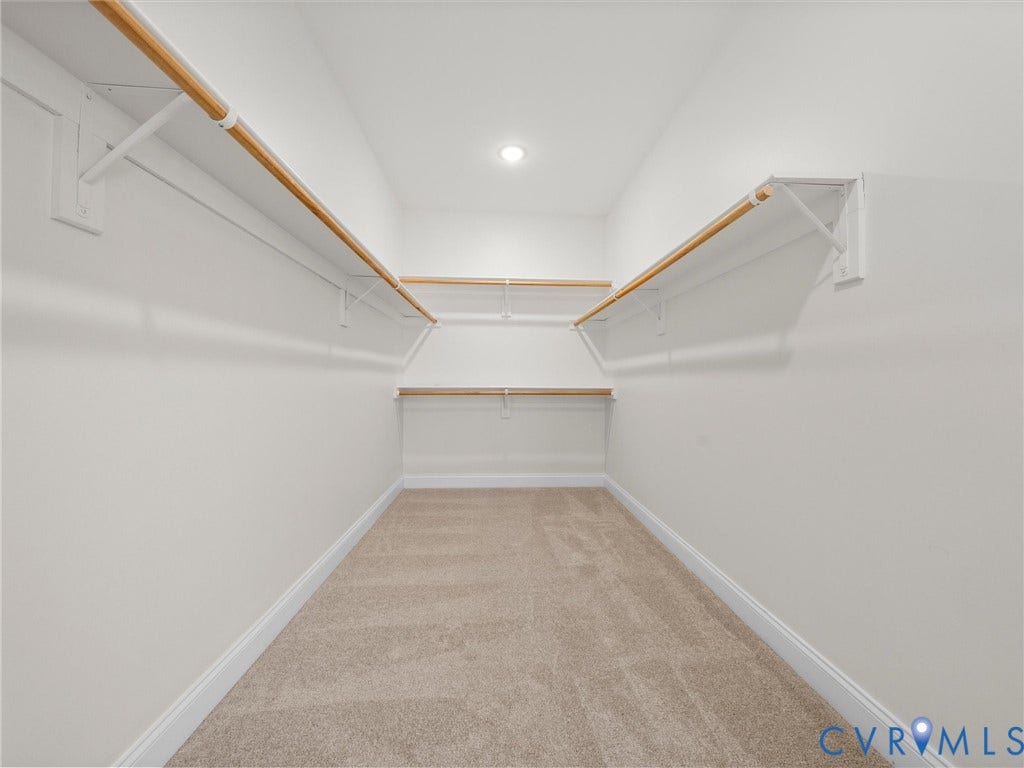 1412 Ascot Hill Terrace, Midlothian, VA 23112 Walk-in closet featuring tiered shelving with wood-finish rods, neutral wall-to-wall carpeting, and recessed lighting