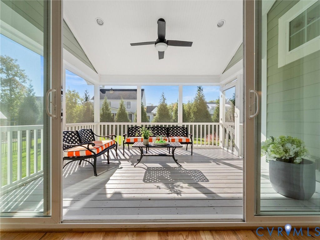 1412 Ascot Hill Terrace, Midlothian, VA 23112 Screened porch featuring painted wood decking, a vaulted ceiling, a matte black ceiling fan, and white railing