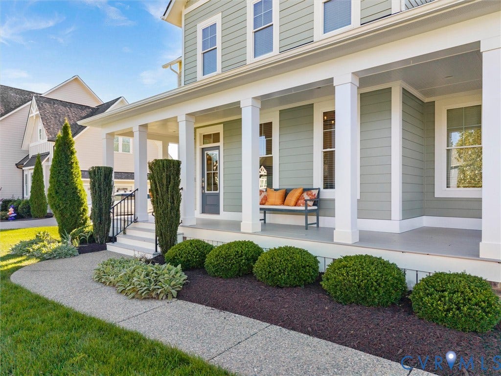 1412 Ascot Hill Terrace, Midlothian, VA 23112 Covered front porch featuring white square columns, lap siding, a glass-paneled entry door, and a concrete walkway