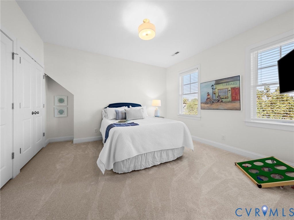 1412 Ascot Hill Terrace, Midlothian, VA 23112 Neutral interior room featuring wall-to-wall carpeting, two double-hung windows, a recessed closet with dual doors, and a semi-flush mount ceiling light fixture
