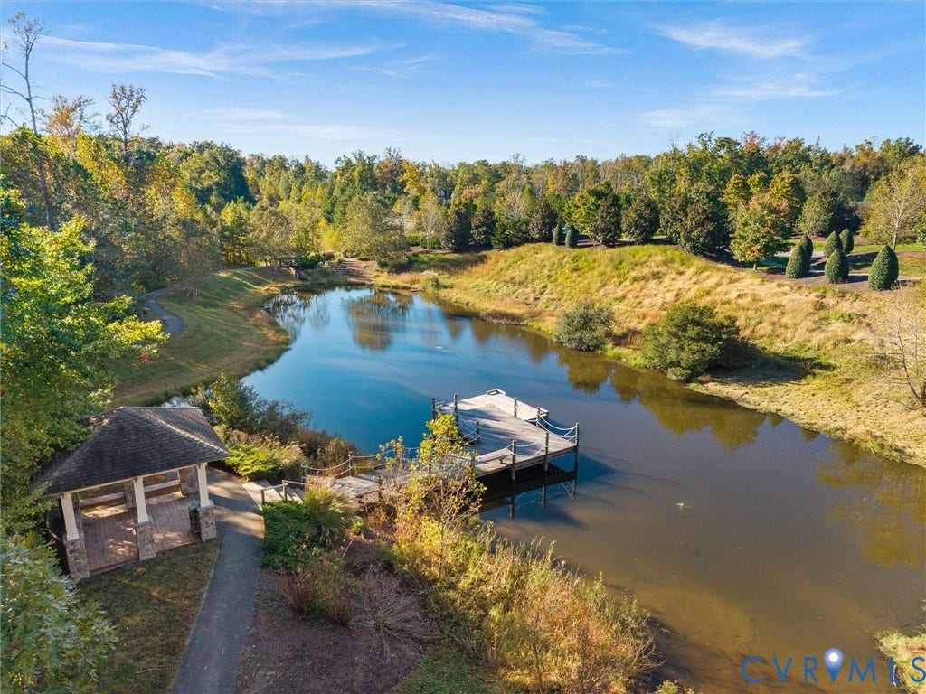 1412 Ascot Hill Terrace, Midlothian, VA 23112 Private pond featuring a stone-based gazebo, wood-plank pier with rope railings, paved pathways, and mature landscaping