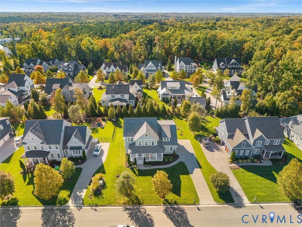 1412 Ascot Hill Terrace, Midlothian, VA 23112 Aerial perspective of the residential community featuring multi-story dwellings, paved concrete driveways, manicured lawns, and mature landscaping