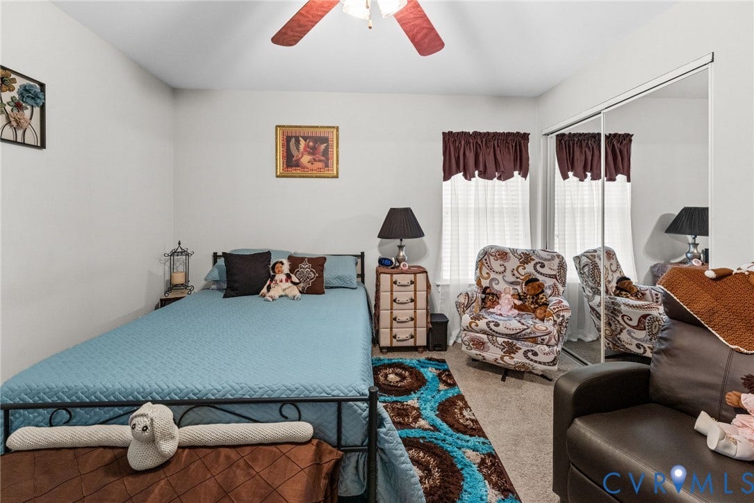 17030 Courtney Road, Reedy Church District, Hanover, VA 23069 Bedroom featuring neutral wall paint, carpeted flooring, a ceiling fan, and a floor-to-ceiling mirrored sliding door closet