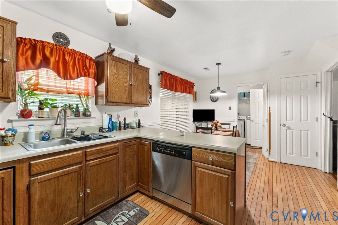 17030 Courtney Road, Reedy Church District, Hanover, VA 23069 Kitchen featuring wood cabinetry, stainless steel dishwasher, wood-finish flooring, dual-basin stainless steel sink, and ceiling-mounted pendant lighting