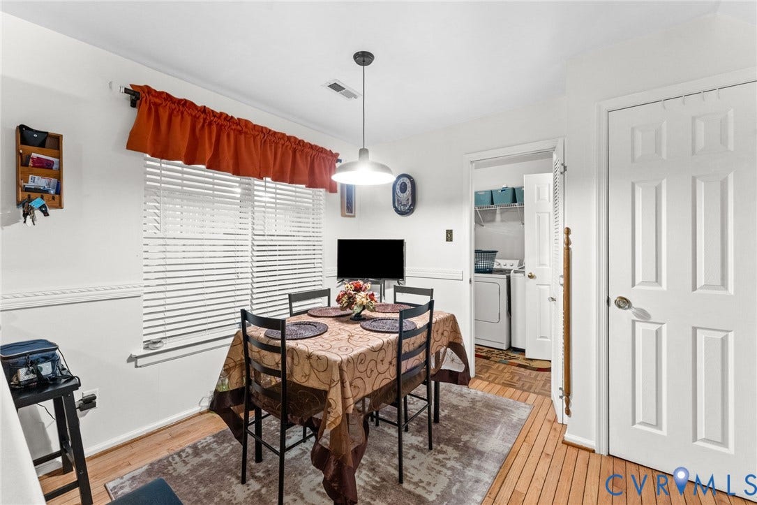17030 Courtney Road, Reedy Church District, Hanover, VA 23069 Dining space featuring wood-finish flooring, chair rail molding, and a central pendant light fixture