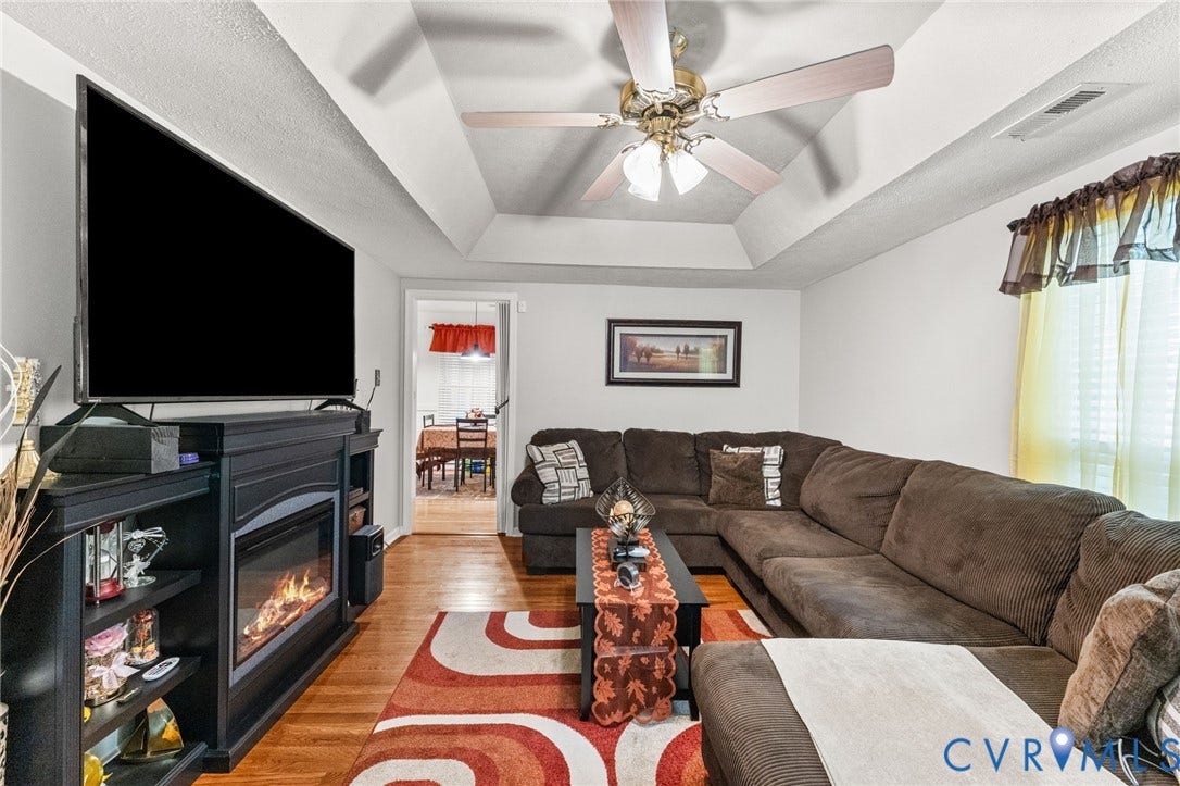 17030 Courtney Road, Reedy Church District, Hanover, VA 23069 Tray ceiling, wood-finish flooring, and built-in fireplace featuring a black mantel