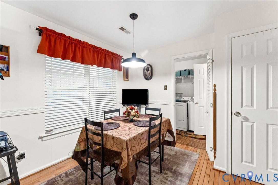 17030 Courtney Road, Reedy Church District, Hanover, VA 23069 Dining space featuring wood-finish flooring, chair rail molding, and a dome pendant light fixture
