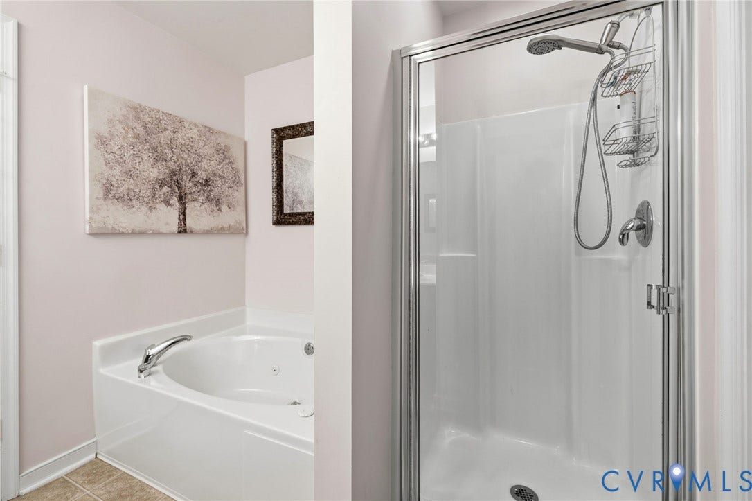 621 Scotter Hills Court, Midlothian, VA 23114 Bathroom featuring a soaking tub and a separate glass-enclosed shower stall with a handheld showerhead