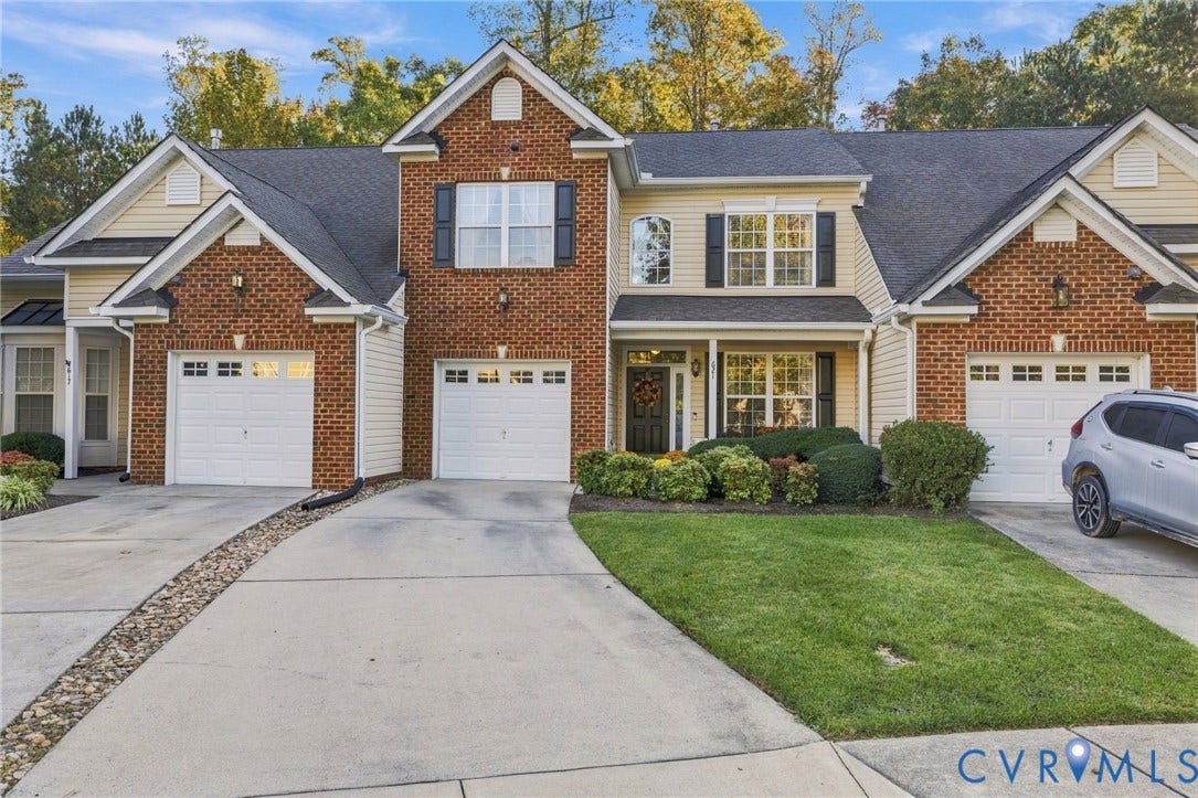 621 Scotter Hills Court, Midlothian, VA 23114 Multi-family exterior featuring brick and horizontal siding, multiple gabled rooflines, two attached garages, and a concrete driveway