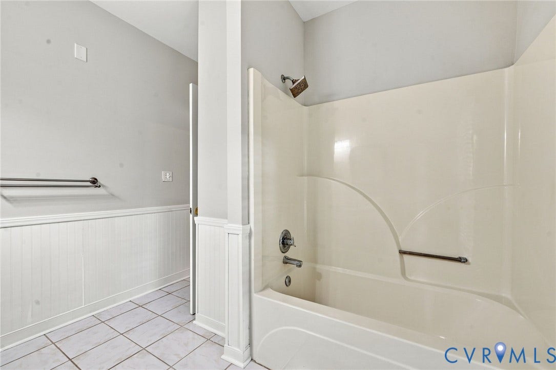 2654 Academy Road, Powhatan, VA 23139 Bathroom featuring a double-vanity, white cabinetry, tile flooring, beadboard wainscoting, and a wall-mounted light fixture