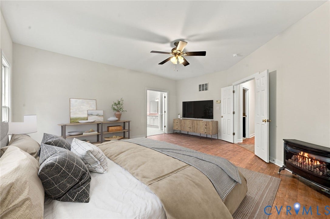 2654 Academy Road, Powhatan, VA 23139 Primary bedroom with LVP floors. Virtually staged concept