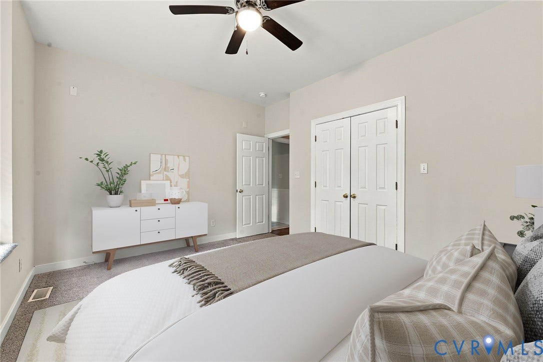 2654 Academy Road, Powhatan, VA 23139 Room featuring neutral wall paint, carpeting, a ceiling fan with integrated lighting, and a double-door closet. Virtually staged concept
