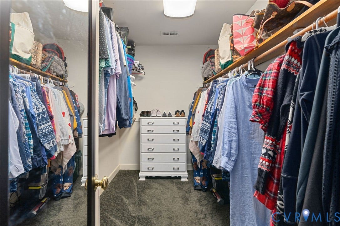4427 Tweedsmuir Court, Midlothian, VA 23120 Walk-in closet featuring dual-sided wall-mounted shelving and a full-length mirrored door