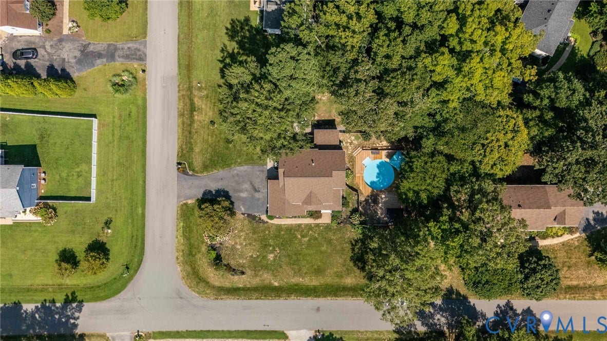 4427 Tweedsmuir Court, Midlothian, VA 23120 Aerial perspective of a residential property featuring an in-ground pool, expansive lawn, multi-level wood decking, and mature tree canopy