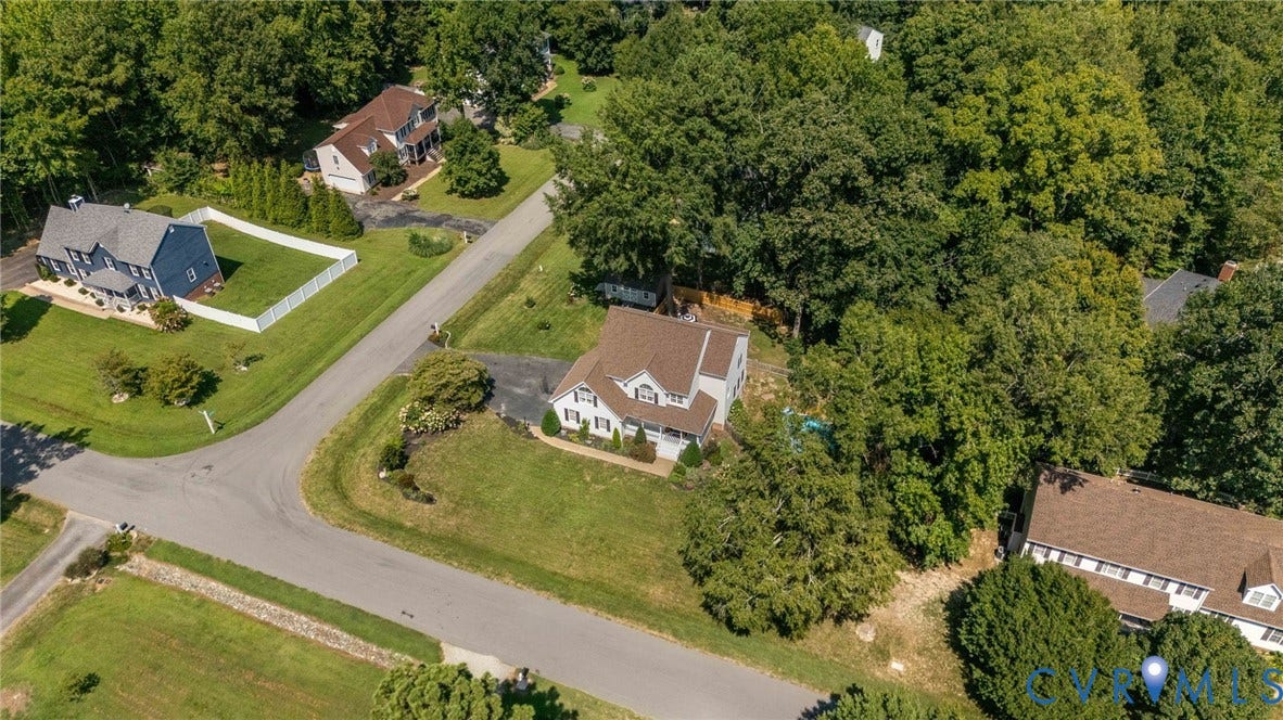 4427 Tweedsmuir Court, Midlothian, VA 23120 Aerial perspective of a detached residence featuring a multi-gabled roof, an asphalt driveway, and a large lot characterized by mature trees
