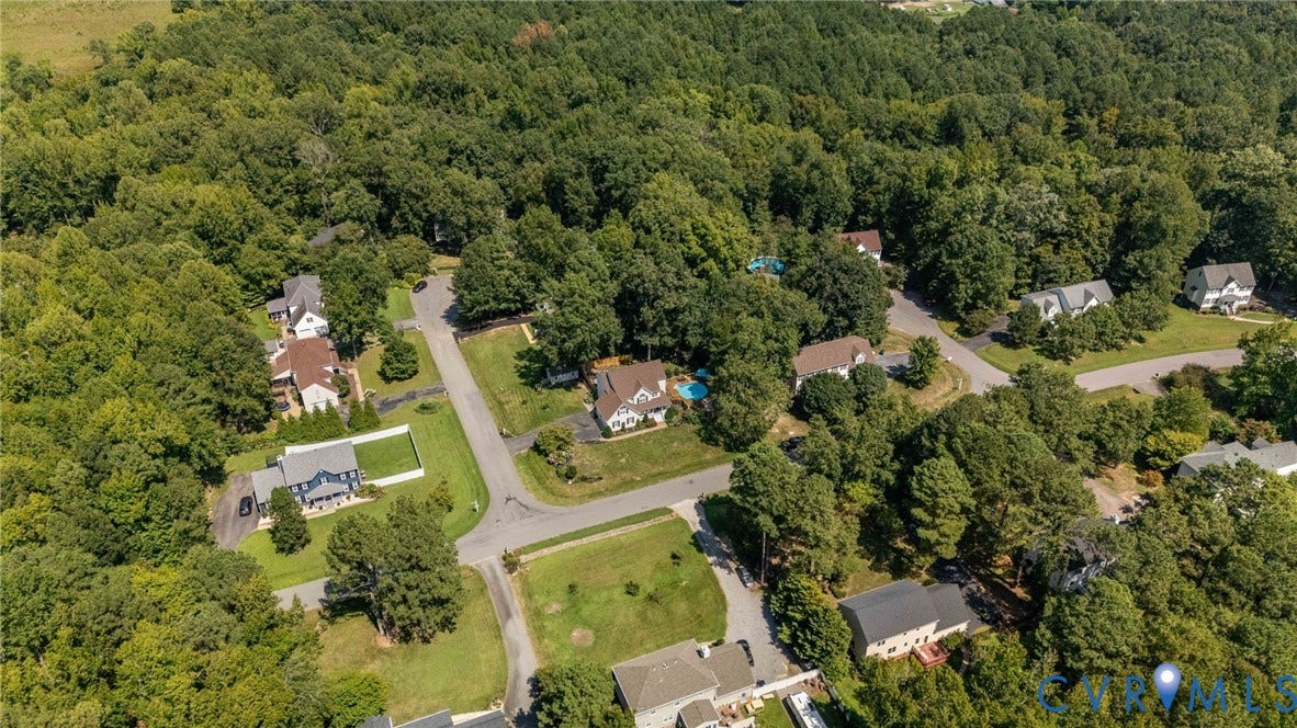 4427 Tweedsmuir Court, Midlothian, VA 23120 Aerial perspective of a residential neighborhood featuring paved streets, detached single-family residences, mature tree cover, and private swimming pools
