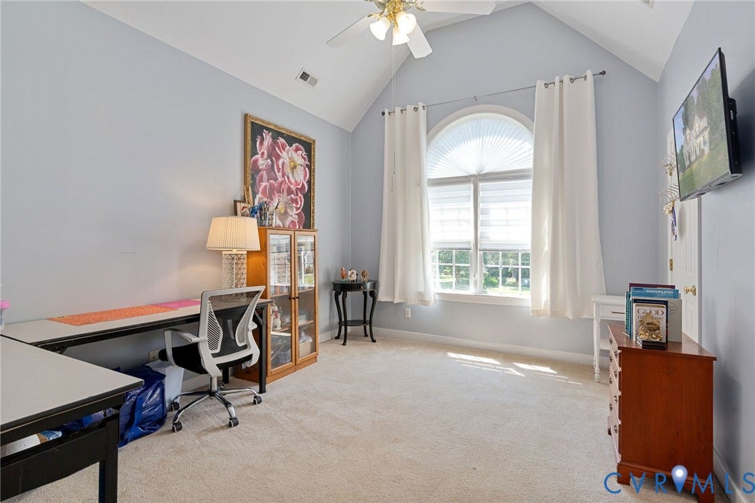 4427 Tweedsmuir Court, Midlothian, VA 23120 Vaulted ceiling, arched window, wall-to-wall carpeting, and a ceiling fan with integrated lighting