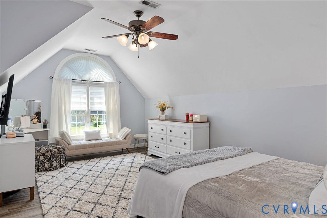 4427 Tweedsmuir Court, Midlothian, VA 23120 Vaulted ceilings, arched window with multi-pane glass, and multi-blade ceiling fan with integrated lighting