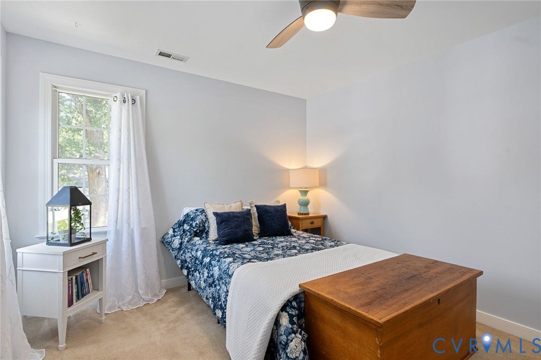 4427 Tweedsmuir Court, Midlothian, VA 23120 Neutral wall color, ceiling fan with light fixture, and window with natural light