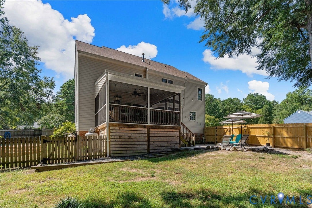 4427 Tweedsmuir Court, Midlothian, VA 23120 Exterior featuring a screened-in porch with ceiling fan, raised wood deck, wood privacy fencing, and stone-bordered patio area