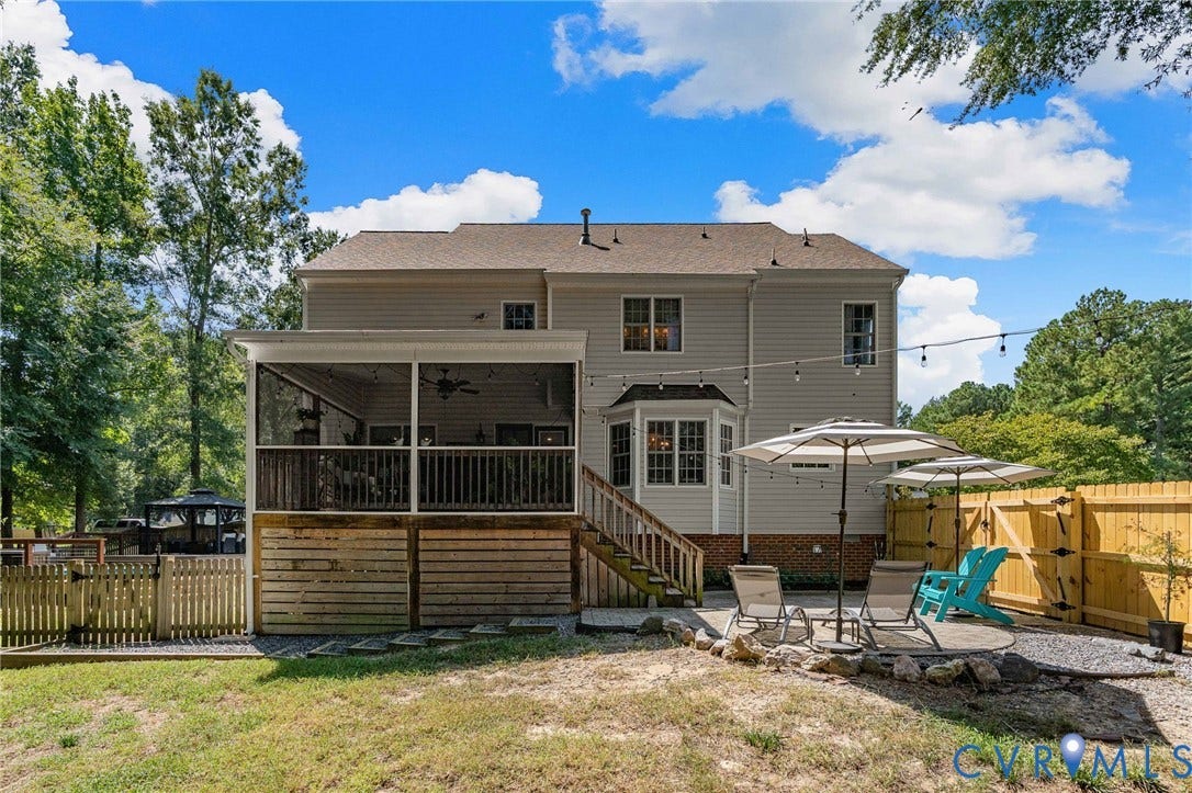 4427 Tweedsmuir Court, Midlothian, VA 23120 Rear exterior featuring a screened porch with ceiling fan, wood-frame deck, stone-paver patio, and wood privacy fencing