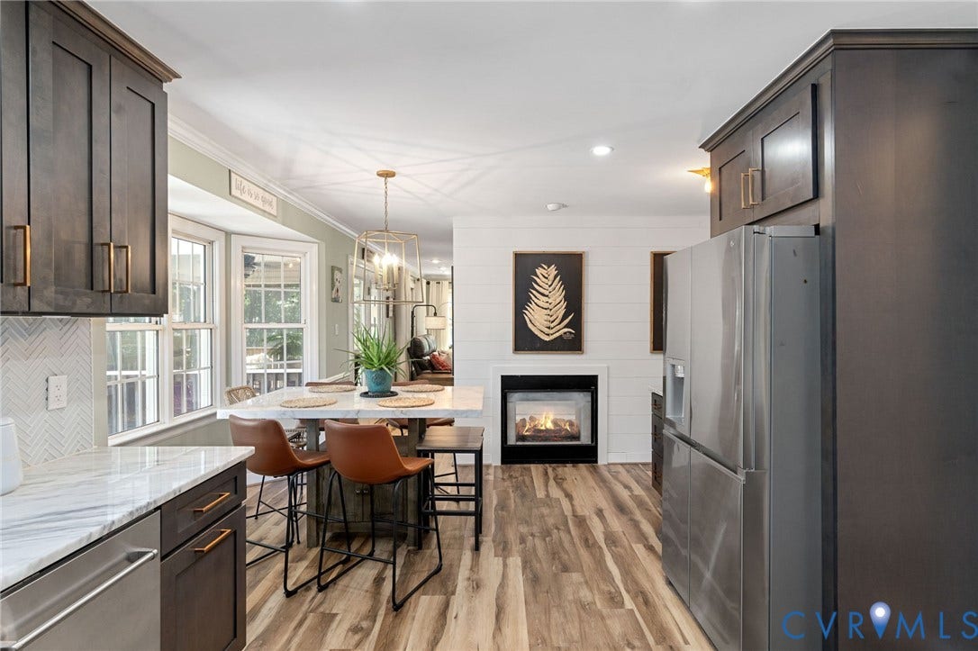 4427 Tweedsmuir Court, Midlothian, VA 23120 Kitchen featuring dark-finish cabinetry, stone-style countertops, stainless steel appliances, shiplap wall accents, and wood-finish flooring