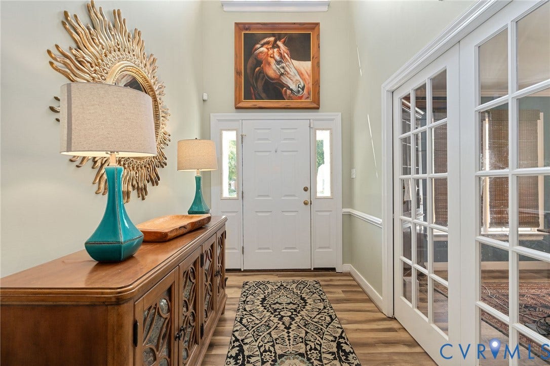 4427 Tweedsmuir Court, Midlothian, VA 23120 Foyer featuring high ceilings, wood-finish flooring, white paneled entry door with dual sidelights, and glass-paneled French doors