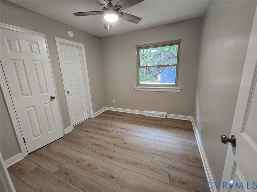 1108 Pierpont Road, Richmond, VA 23225 Bedroom 3 with LVP flooring, a multi-panel door, and a ceiling fan with integrated lighting