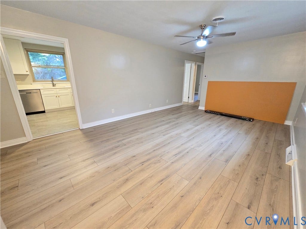 1108 Pierpont Road, Richmond, VA 23225 Front door entry into your spacious Family Room featuring LVP flooring, a ceiling fan with integrated lighting, and neutral wall paint
