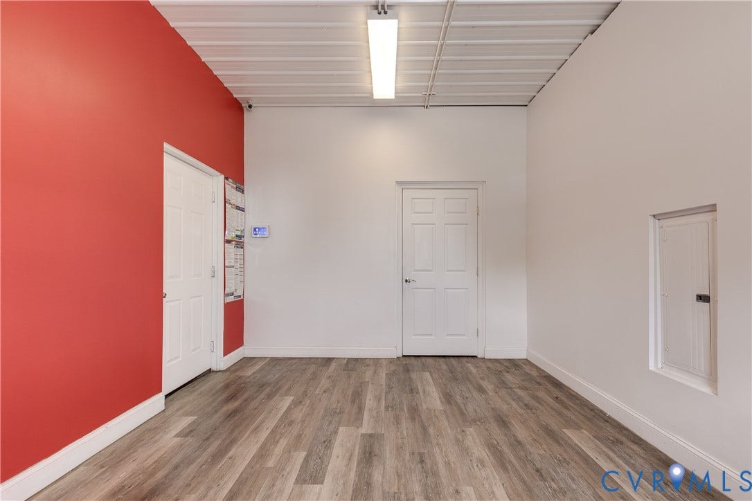 3300 Hull Street, Richmond, VA 23224 Wood-finish flooring, high ceilings, recessed linear lighting, two interior doors, and a built-in electrical panel enclosure