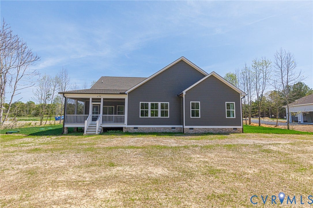 8860 Emily Jane Place, Quinton, VA 23141 The property features grey siding, a screened-in porch with white railings, and a gravel foundation