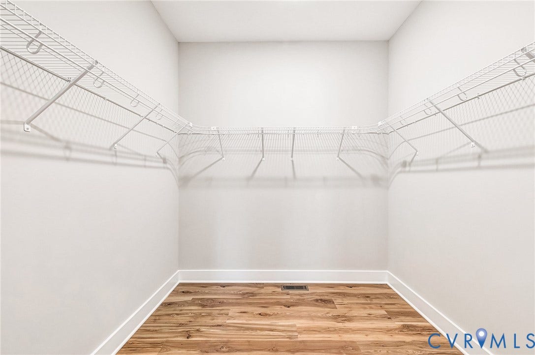 8860 Emily Jane Place, Quinton, VA 23141 Well-organized closet featuring wire shelving and wood flooring