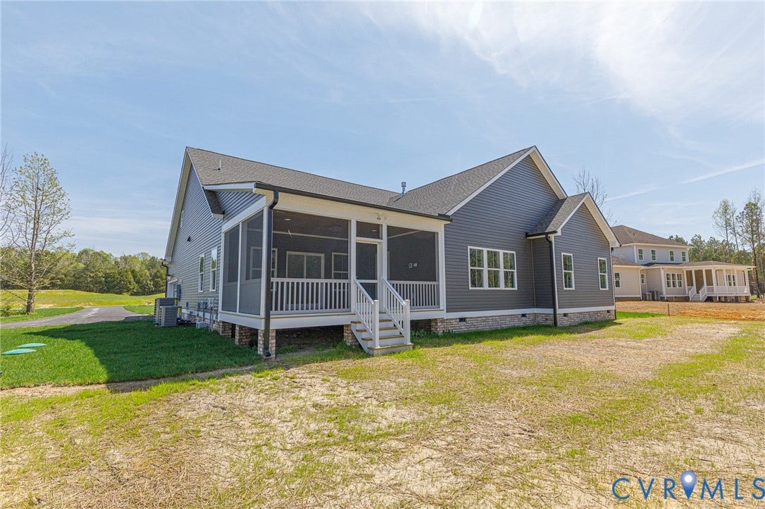 8860 Emily Jane Place, Quinton, VA 23141 This property features a screened porch with white railings, a grey exterior with white trim, and a dark shingled roof