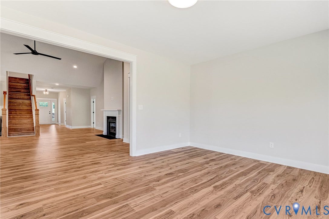 8860 Emily Jane Place, Quinton, VA 23141 The property features hardwood floors throughout, with bright white walls and trim