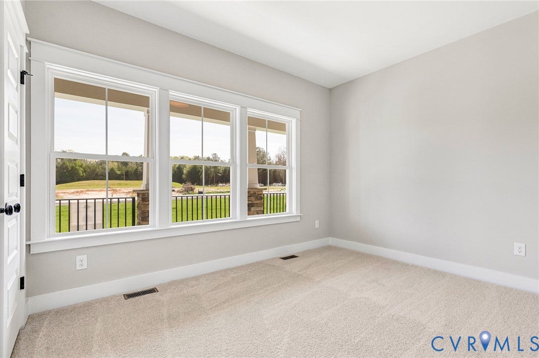 8860 Emily Jane Place, Quinton, VA 23141 Room featuring light-colored carpet, neutral painted walls, and a white door with black hardware