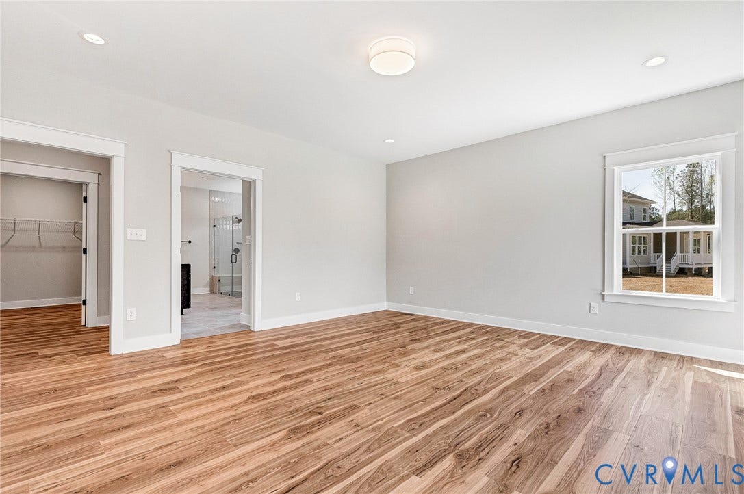 8860 Emily Jane Place, Quinton, VA 23141 Bright interior room featuring wood-look flooring, light-colored walls, and recessed lighting