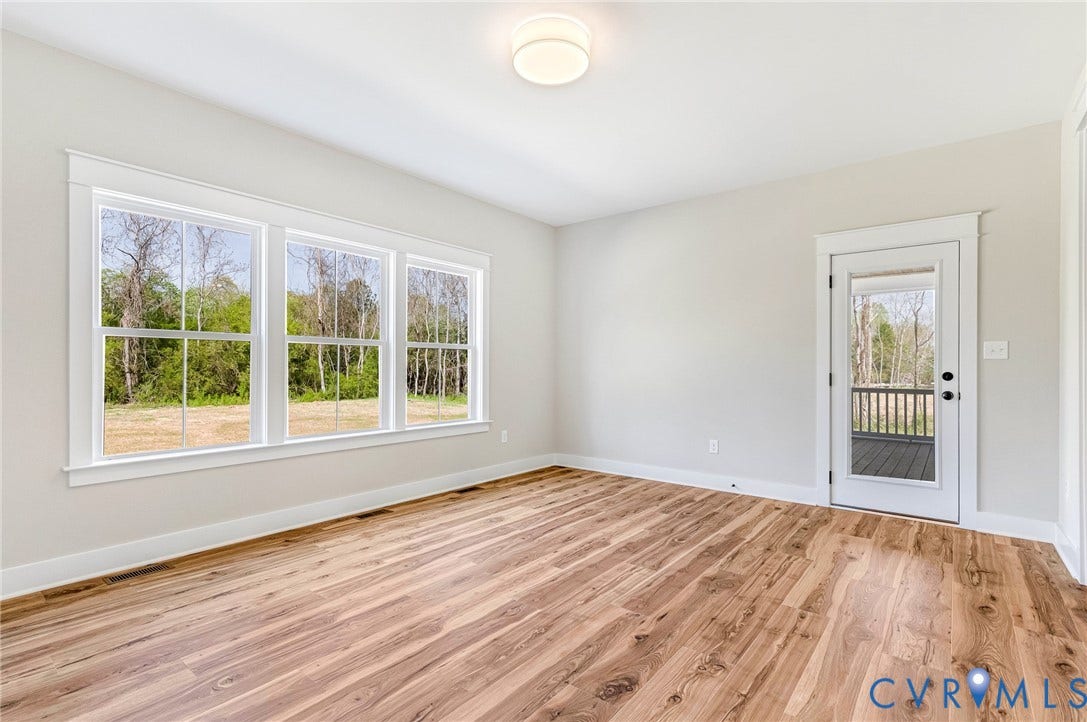 8860 Emily Jane Place, Quinton, VA 23141 This room features hardwood flooring, white walls, and a recessed ceiling light