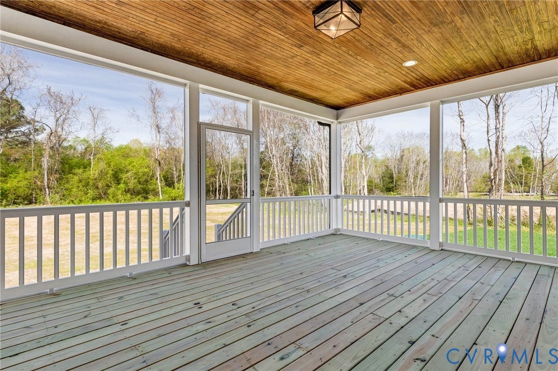 8860 Emily Jane Place, Quinton, VA 23141 Screened porch featuring a wooden plank ceiling, recessed lighting, and a view of the surrounding trees and natural landscape