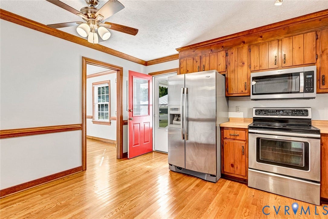6432 Bellflower Circle, Mechicsville, Mechanicsville, VA 23111 Kitchen featuring natural wood cabinetry, stainless steel appliances, wood-finish flooring, ceiling fan with integrated lighting, and crown molding