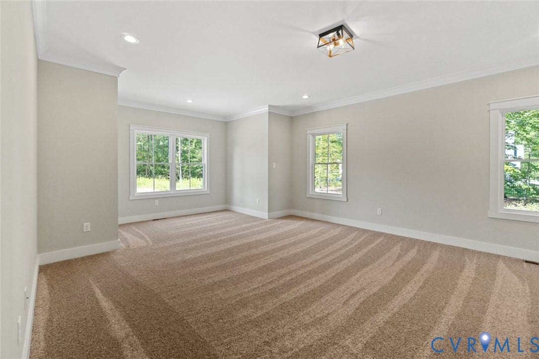 14270 Tower Road, Scotchtown Estates, Montpelier, VA 23047 Neutral wall palette with crown molding, plush carpeting, recessed lighting, and a geometric flush-mount light fixture
