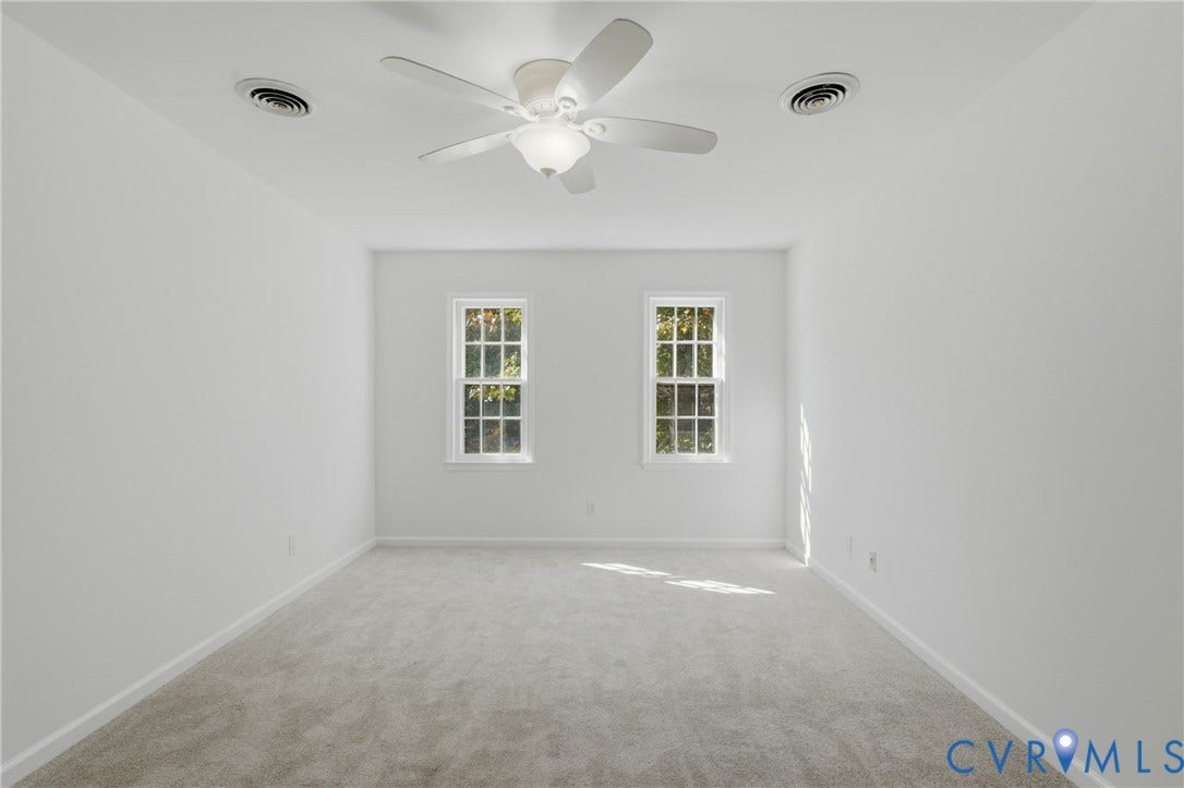 12506 Mandolin Drive, Chesterfield, VA 23113 Neutral-toned carpeting, multi-pane windows, and a ceiling-mounted fan with integrated light fixture