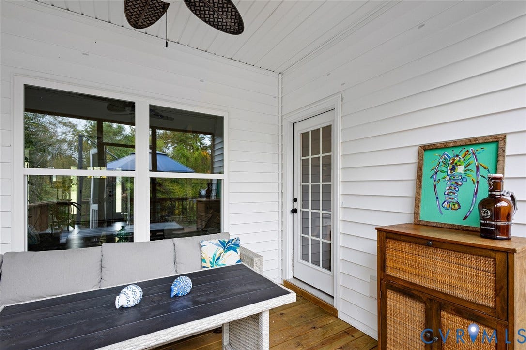 360 Anderson Mill Drive, Anderson Mill, Bumpass, VA 23024 Covered patio featuring white horizontal siding, wood-finish flooring, a ceiling fan, and a glass-paned door