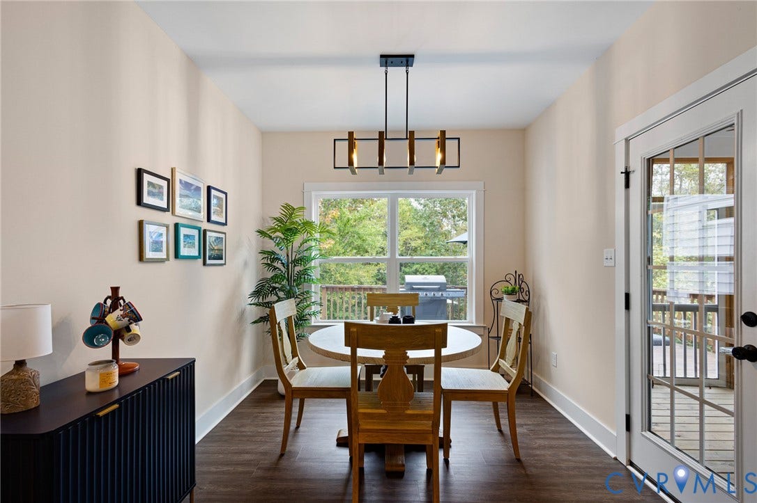 360 Anderson Mill Drive, Anderson Mill, Bumpass, VA 23024 Dining area featuring wood-finish flooring, a contemporary geometric pendant light, a large window, and a glass-paneled exterior door