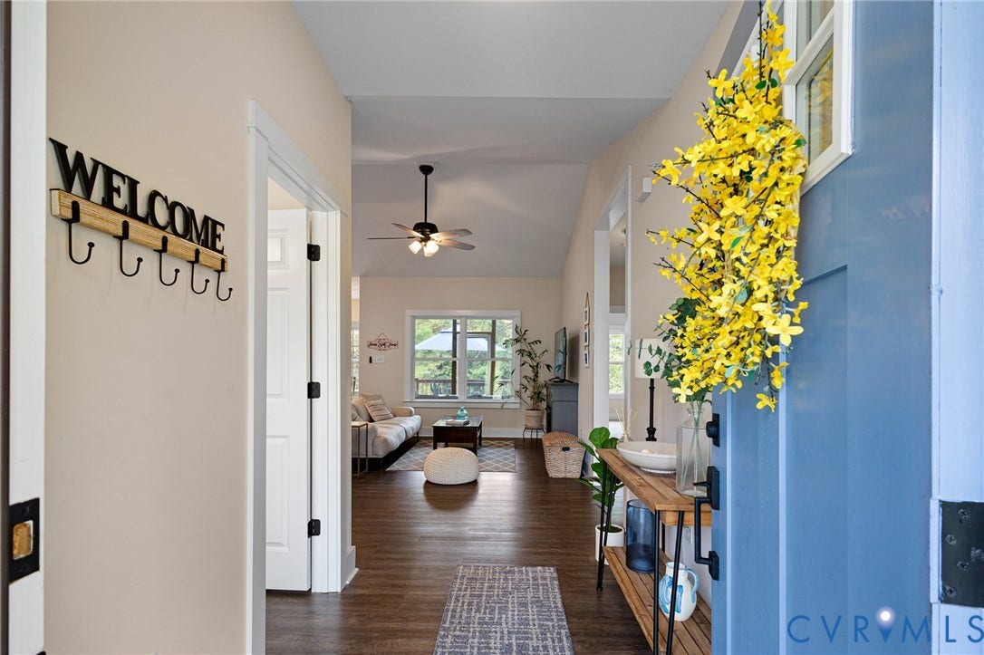 360 Anderson Mill Drive, Anderson Mill, Bumpass, VA 23024 Entryway featuring wood-finish flooring, a blue front door with an inset window, and a vaulted ceiling with a multi-light ceiling fan