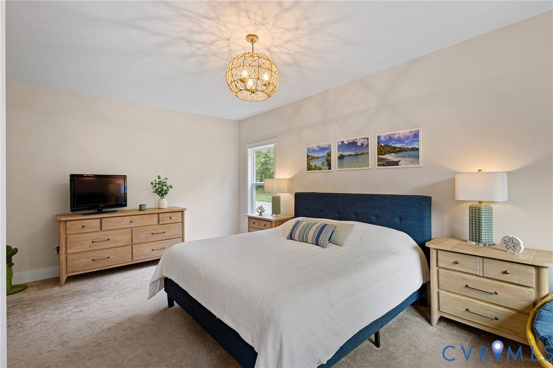360 Anderson Mill Drive, Anderson Mill, Bumpass, VA 23024 Neutral wall palette, carpeted flooring, and decorative spherical metal-frame ceiling lighting