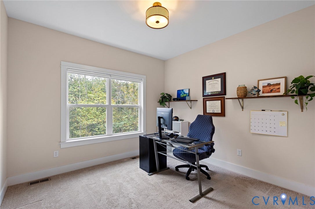 360 Anderson Mill Drive, Anderson Mill, Bumpass, VA 23024 Neutral-toned interior featuring wall-to-wall carpeting, dual-pane window with white casing, and a drum-style ceiling light fixture