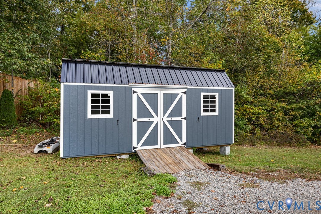 360 Anderson Mill Drive, Anderson Mill, Bumpass, VA 23024 Outbuilding featuring vertical siding, metal roofing, double-door entry, multi-pane windows, and a wood ramp