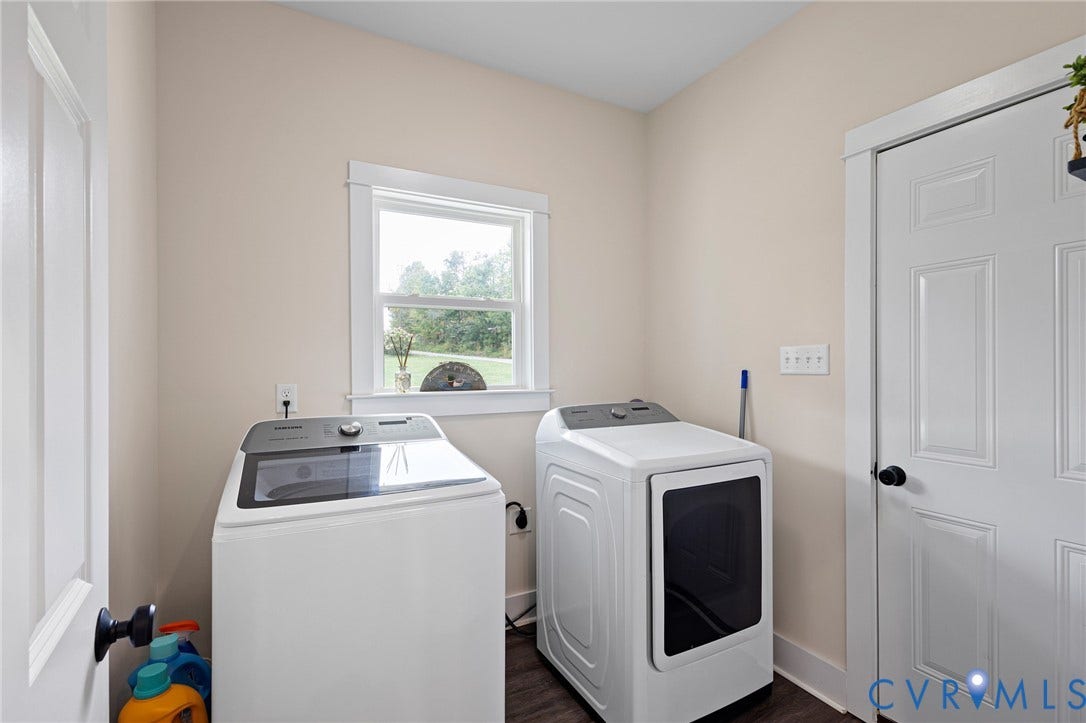 360 Anderson Mill Drive, Anderson Mill, Bumpass, VA 23024 Utility area featuring wood-finish flooring, a single-hung window with casing, and a six-panel interior door