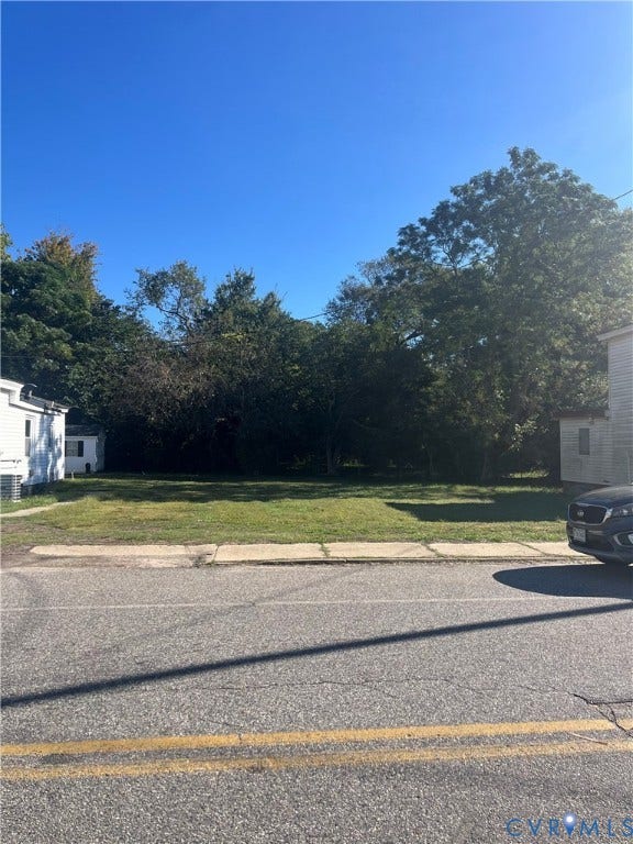 327 N Crater Road, Petersburg, VA 23803 Cleared level lot featuring mature trees along the perimeter and frontage sidewalk access